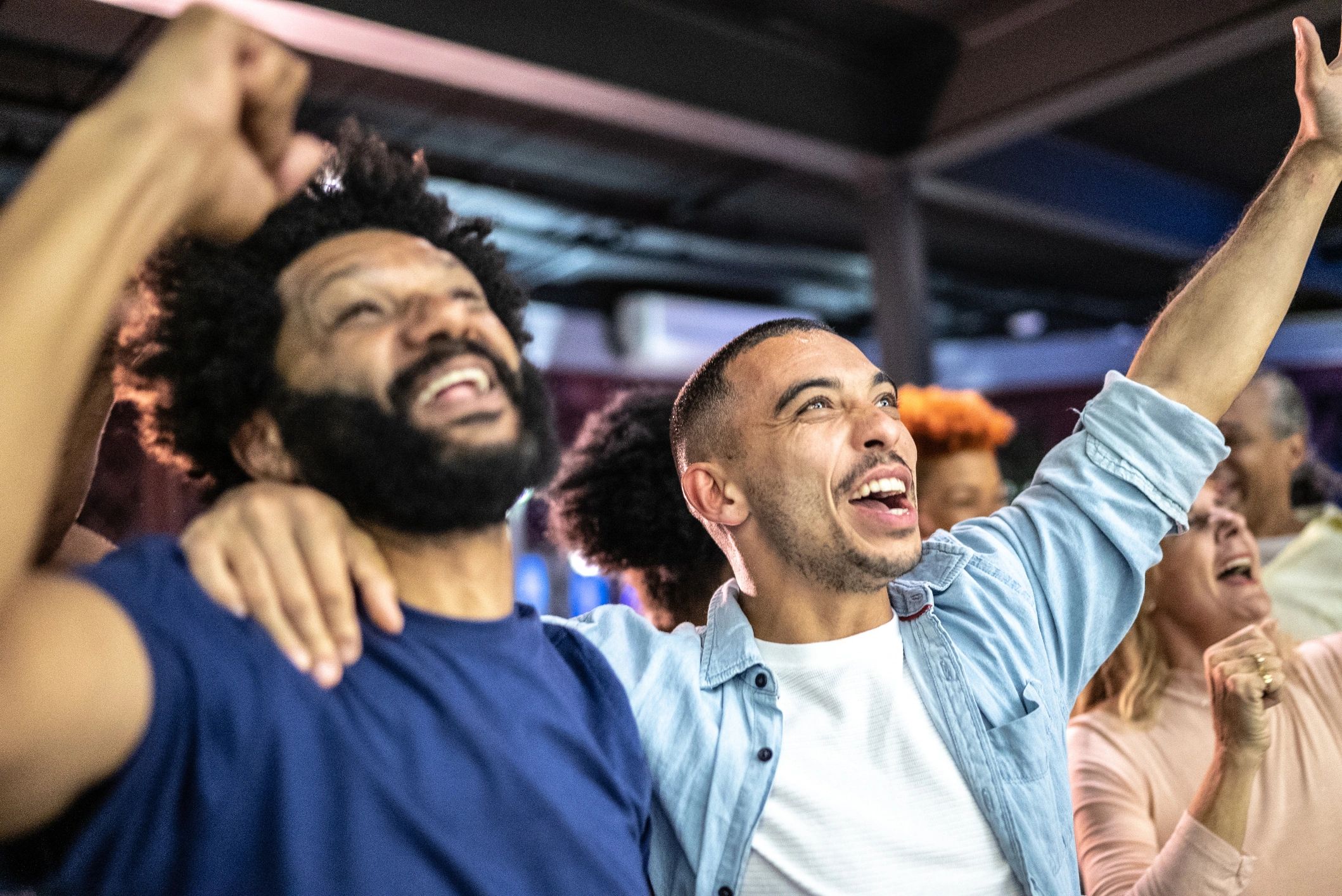 Fans watching sport together in a pub