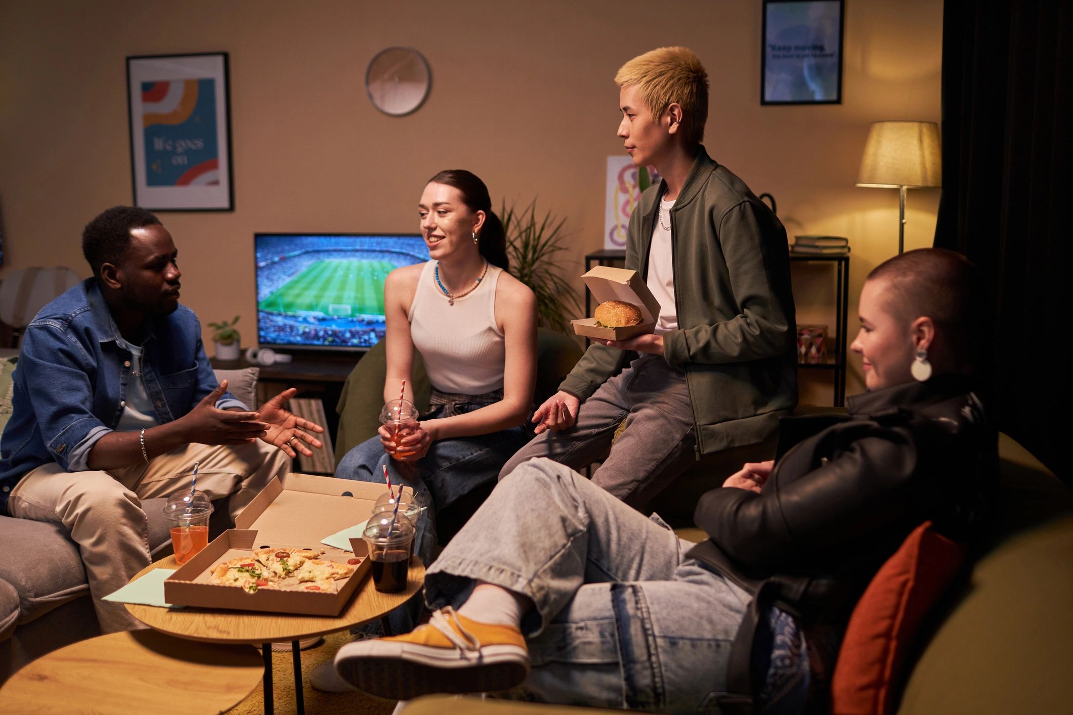 Friends gathered with food and drinks
